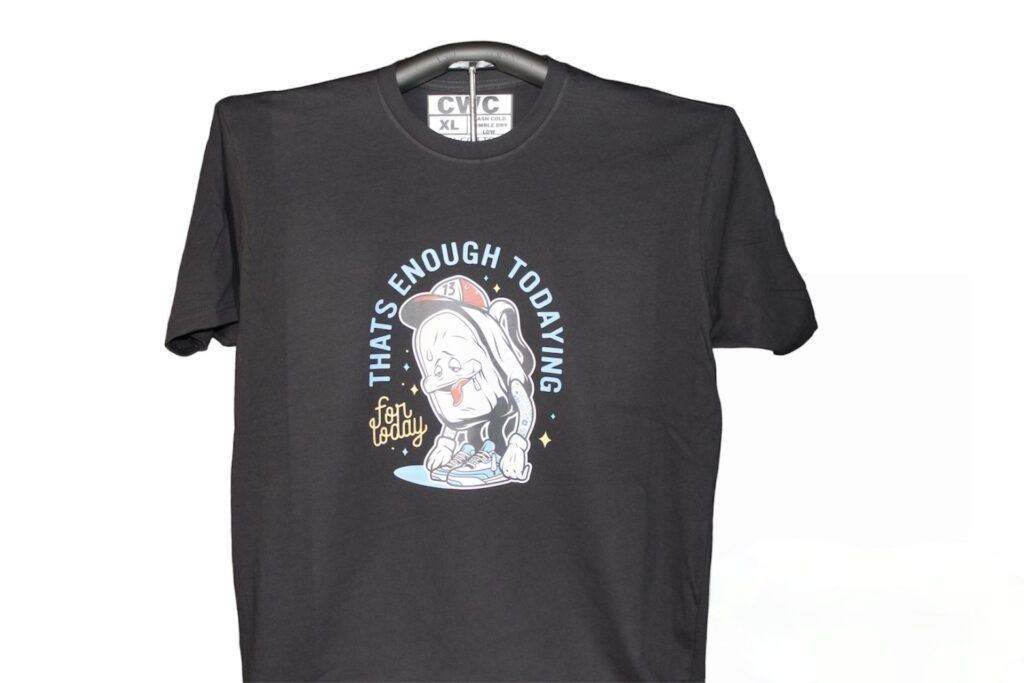 A black t-shirt featuring the phrase "that's enough today" prominently displayed on the front.